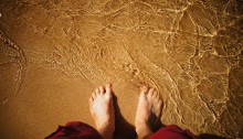 Photograph of feet in sand
